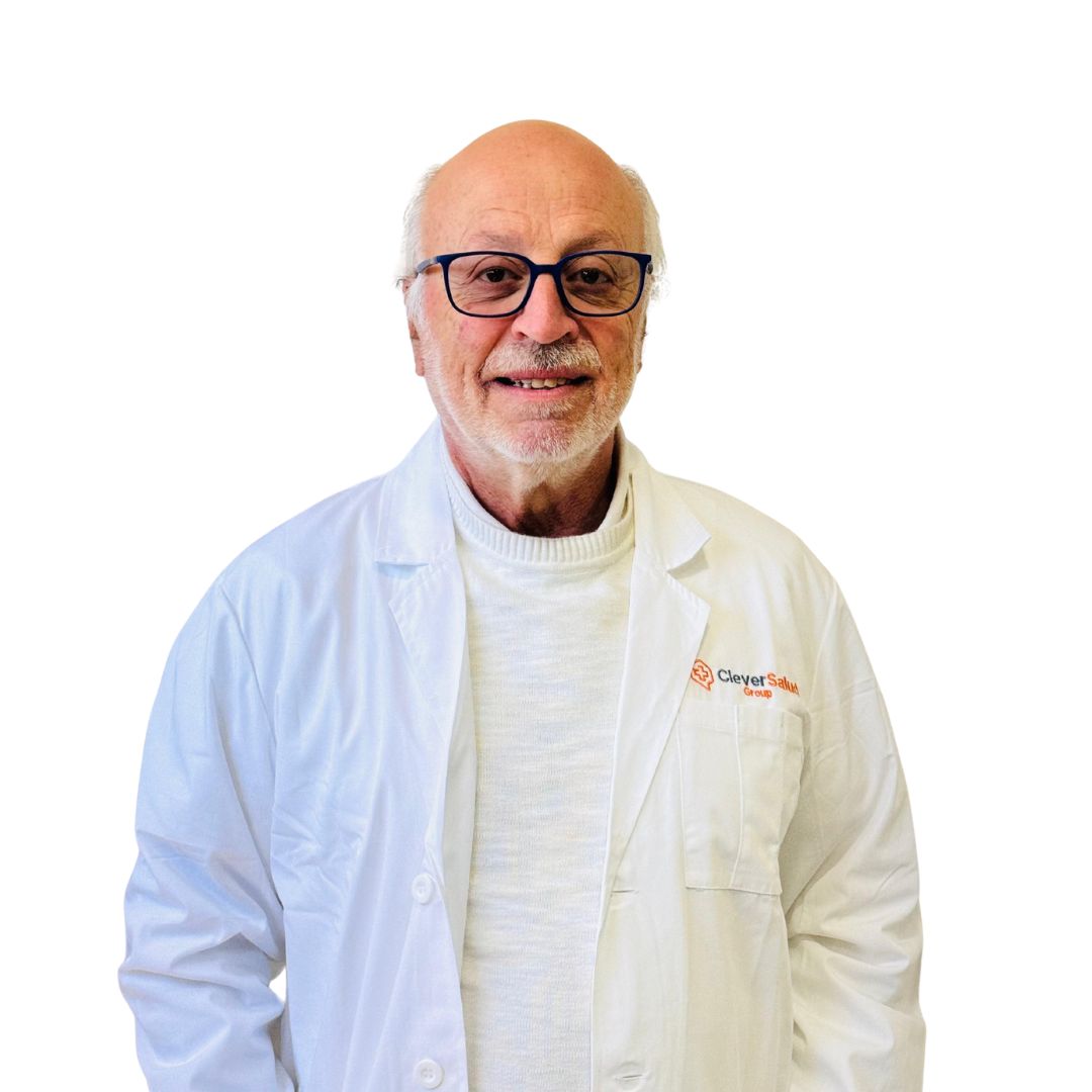 Portrait of an older man in a white lab coat with glasses, smiling at the camera.