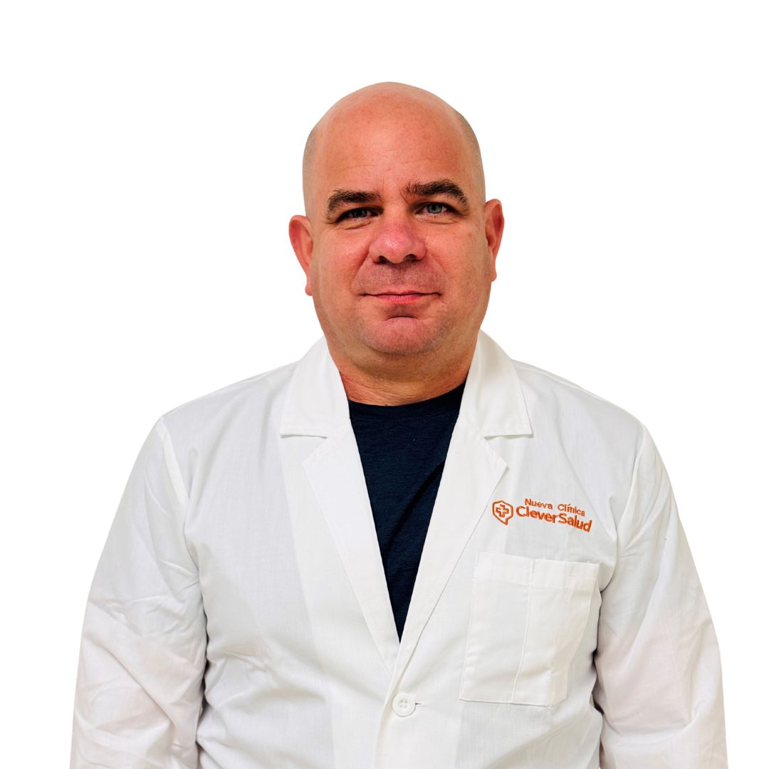 Portrait of a bald male doctor wearing a white lab coat, standing against a white background.