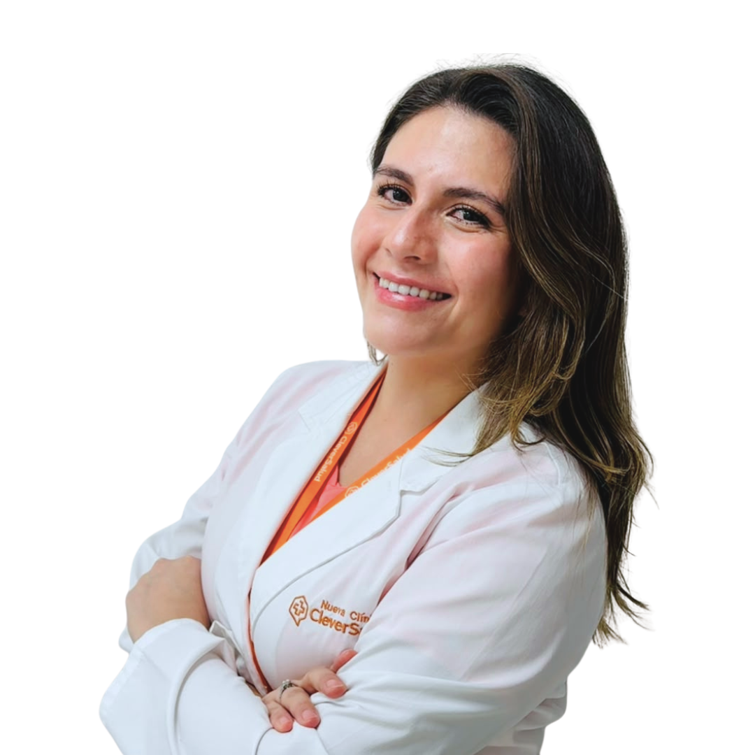 Smiling healthcare professional with arms crossed, wearing a white coat and orange lanyard.