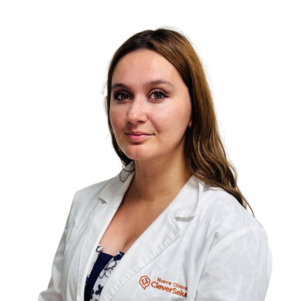 Portrait of a female clinician in a white lab coat, facing the camera.
